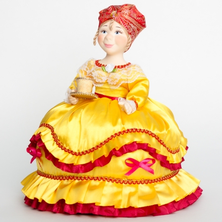 Doll-warmer on a teapot with a cup of tea yellow 30cm